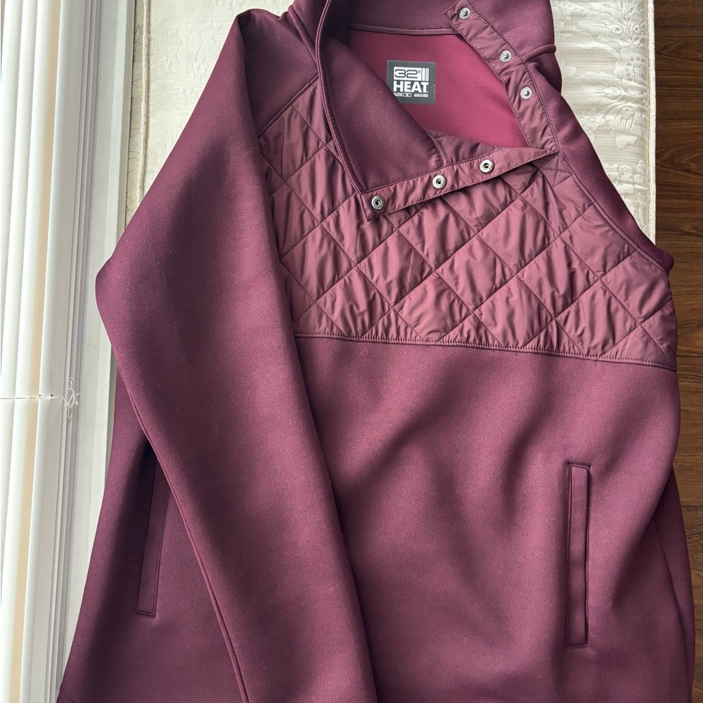 Women's Quilted Burgundy Jacket with snap collar and pockets.